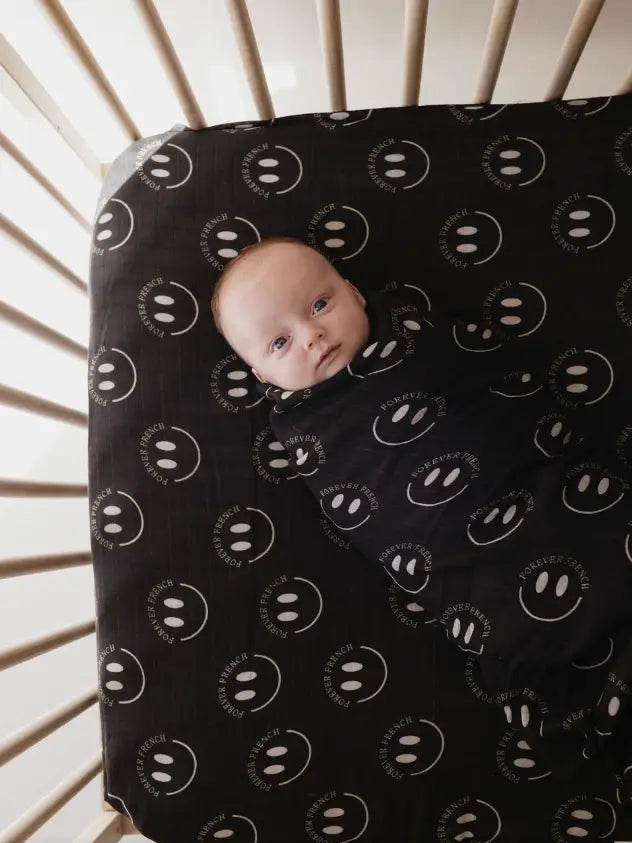 Forever French Smile Muslin Swaddle